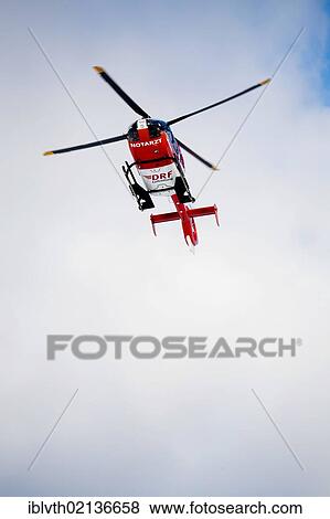 Rescue helicopter approaching, rescue operation with a rescue helicopter in the Thuringian Slate Mountains, Thuringia, Germany, Europe View Large Photo Image Stock Photo - Rescue helicopter approaching, rescue operation with a rescue helicopter in the Thuringian Slate Mountains, Thuringia, Germany, Europe. Fotosearch
