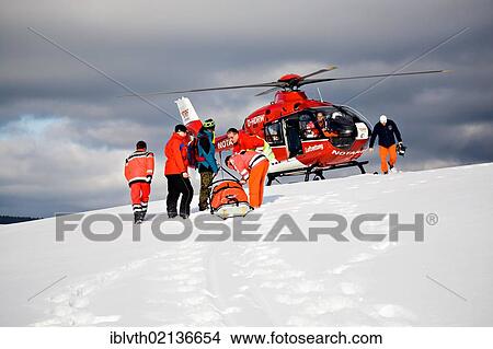 Rescue operation with a rescue helicopter in the Thuringian Slate Mountains, Thuringia, Germany, Europe View Large Photo Image Picture - Rescue operation with a rescue helicopter in the Thuringian Slate Mountains, Thuringia, Germany, Europe. Fotosearch