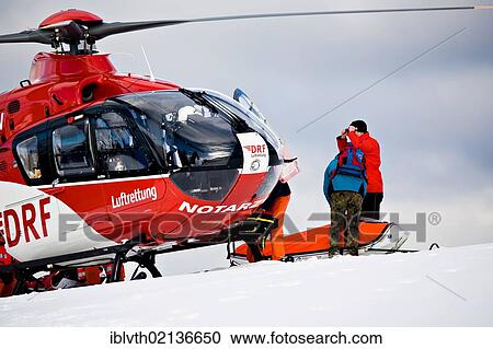 Rescue operation with a rescue helicopter in the Thuringian Slate Mountains, Thuringia, Germany, Europe View Large Photo Image Stock Image - Rescue operation with a rescue helicopter in the Thuringian Slate Mountains, Thuringia, Germany, Europe. Fotosearch