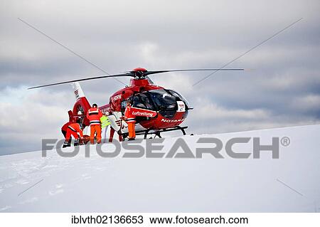Rescue operation with a rescue helicopter in the Thuringian Slate Mountains, Thuringia, Germany, Europe View Large Photo Image Stock Image - Rescue operation with a rescue helicopter in the Thuringian Slate Mountains, Thuringia, Germany, Europe. Fotosearch
