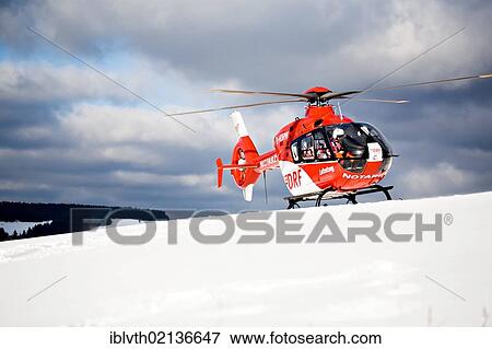 Rescue operation with a rescue helicopter in the Thuringian Slate Mountains, Thuringia, Germany, Europe View Large Photo Image Stock Photo - Rescue operation with a rescue helicopter in the Thuringian Slate Mountains, Thuringia, Germany, Europe. Fotosearch