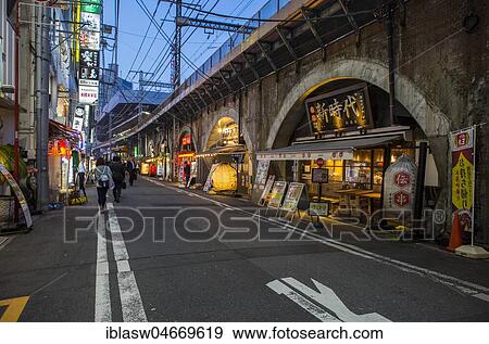 Restaurants under drawbridge at dusk, Shimbashi, Tokyo, Japan, Asia View Large Photo Image Stock Photo - Restaurants under drawbridge at dusk, Shimbashi, Tokyo, Japan, Asia. Fotosearch