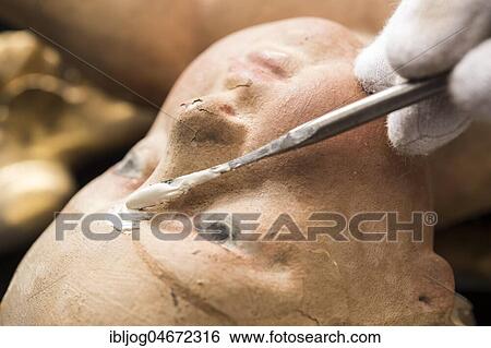 Restoration studio, restorer, filling compound is applied with spatula to the face of an angel, Munich, Bavaria, Germany, Europe View Large Photo Image Stock Photograph - Restoration studio, restorer, filling compound is applied with spatula to the face of an angel, Munich, Bavaria, Germany, Europe. Fotosearch