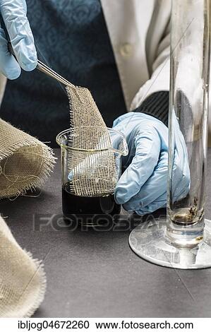 Restoration studio, restorer, hand dipping a piece of linen with tweezers in a colour sample for supporting tissue, Munich, Bavaria, Germany, Europe View Large Photo Image Stock Image - Restoration studio, restorer, hand dipping a piece of linen with tweezers in a colour sample for supporting tissue, Munich, Bavaria, Germany, Europe. Fotosearch