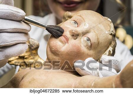 Restoration studio, restorer, hand cleans angel with brush, Munich, Bavaria, Germany, Europe View Large Photo Image Stock Photography - Restoration studio, restorer, hand cleans angel with brush, Munich, Bavaria, Germany, Europe. Fotosearch