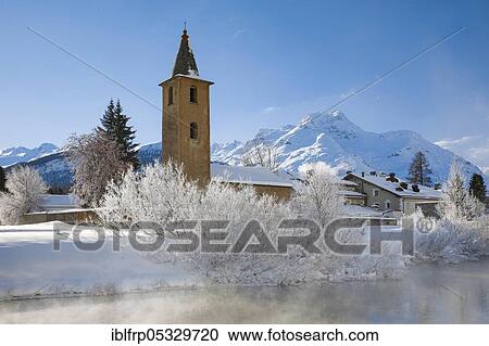 Stock Image - River Inn, St. Lawrence Church, Sils, Graubuenden, Switzerland, Europe. Fotosearch