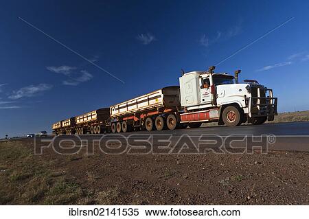 Road Train, 2AB quad, on a country road outside of Port Hedland, Western Australia, Australia, Oceania View Large Photo Image Stock Photography - Road Train, 2AB quad, on a country road outside of Port Hedland, Western Australia, Australia, Oceania. Fotosearch