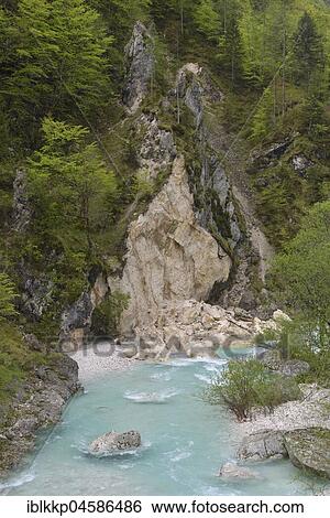 Stock Photograph - Rock break-off at the wild river Soča, Soča-Valley, Julian Alps, Slovenia, Europe. Fotosearch