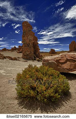 Rock formations against a blue cloudy sky, Uyuni, Bolivia, South America View Large Photo Image Stock Photography - Rock formations against a blue cloudy sky, Uyuni, Bolivia, South America. Fotosearch