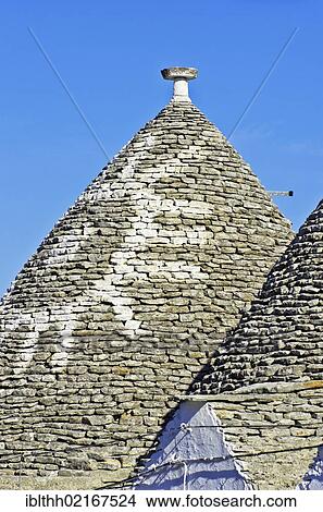Roof of a trullo, a traditional dry stone hut with a conical roof, in the village of Alberobello, Puglia, Italy, Europe View Large Photo Image Picture - Roof of a trullo, a traditional dry stone hut with a conical roof, in the village of Alberobello, Puglia, Italy, Europe. Fotosearch