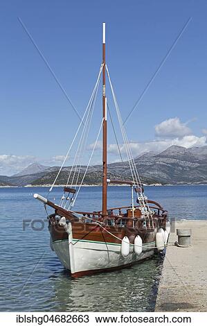 Sailboat at a jetty, Lopud Island, Elaphite Islands, Dalmatia, Croatia, Europe View Large Photo Image Stock Image - Sailboat at a jetty, Lopud Island, Elaphite Islands, Dalmatia, Croatia, Europe. Fotosearch