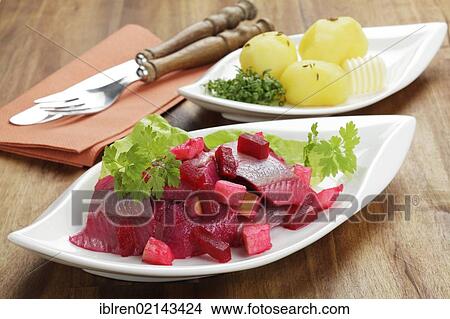 Salad of soused herring with beetroot and apple pieces, served with boiled potatoes View Large Photo Image Picture - Salad of soused herring with beetroot and apple pieces, served with boiled potatoes. Fotosearch