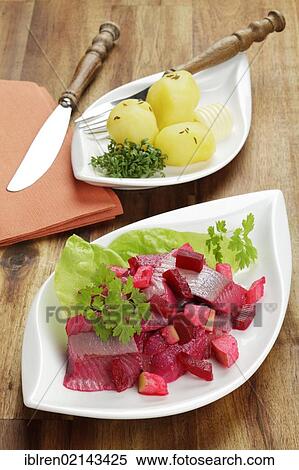 Salad of soused herring with beetroot and apple pieces, served with boiled potatoes View Large Photo Image Stock Photography - Salad of soused herring with beetroot and apple pieces, served with boiled potatoes. Fotosearch