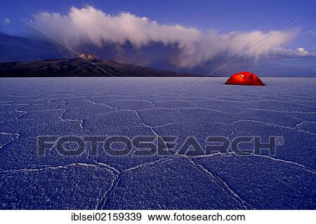 Stock Photo - Salt lake with a tent during the blue hour, Salar de Uyuni, Uyuni, Bolivia, South America. Fotosearch