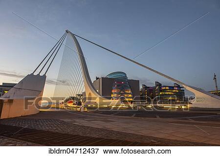 Samuel Beckett Bridge, cable-stayed bridge and swing bridge over the river Liffey, blue hour, architect Santiago Calatrava, Dublin, Republic of Ireland View Large Photo Image Stock Photo - Samuel Beckett Bridge, cable-stayed bridge and swing bridge over the river Liffey, blue hour, architect Santiago Calatrava, Dublin, Republic of Ireland. Fotosearch