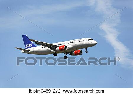 Stock Image - Scandinavian Airbus A320 passenger aircraft, on landing approach to Franz Josef Strauss Airport, Munich, Upper Bavaria, Germany, Europe. Fotosearch