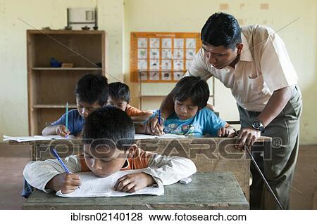 Schoolchildren learning to write in an elementary school in a village with no road access in the rainforest of the Oriente, Curaray, Ecuador, South America View Large Photo Image Stock Photo - Schoolchildren learning to write in an elementary school in a village with no road access in the rainforest of the Oriente, Curaray, Ecuador, South America. Fotosearch