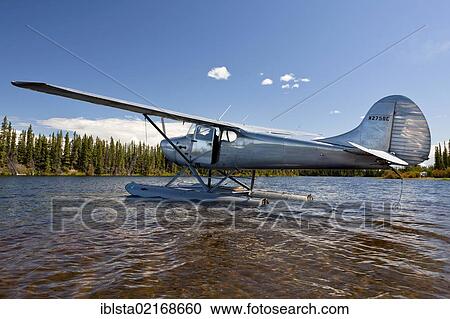 Stock Image - Seaplane on Moon Lake in Alaska, USA, PublicGround, North America. Fotosearch