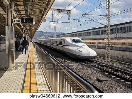 Shinkansen high-speed train travels through Mishima Station, Shizuoka Prefecture, Japan, Asia View Large Photo Image Stock Image - Shinkansen high-speed train travels through Mishima Station, Shizuoka Prefecture, Japan, Asia. Fotosearch