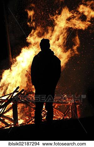Silhouette of a man in front of a bonfire, Hagenbuch, Biberach district, Upper Swabia, Germany, Europe View Large Photo Image Picture - Silhouette of a man in front of a bonfire, Hagenbuch, Biberach district, Upper Swabia, Germany, Europe. Fotosearch