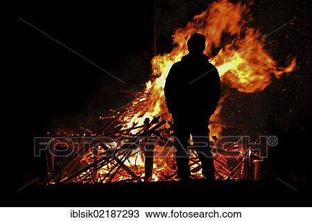 Silhouette of a man in front of a bonfire, Hagenbuch, Biberach district, Upper Swabia, Germany, Europe View Large Photo Image Stock Image - Silhouette of a man in front of a bonfire, Hagenbuch, Biberach district, Upper Swabia, Germany, Europe. Fotosearch