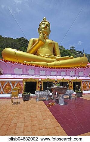 Stock Image - Sitting Golden Buddha, Temple Wat Khao Rang, Phuket, Thailand, Asia. Fotosearch