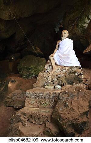 Sitting statue of a monk in the cave temple Wat Tham Suwan Khuha, Phang Nga, Thailand, Asia View Large Photo Image Stock Photo - Sitting statue of a monk in the cave temple Wat Tham Suwan Khuha, Phang Nga, Thailand, Asia. Fotosearch