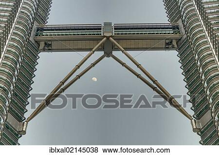 Stock Photo - Skybridge of the Petronas Towers and moon, Kuala Lumpur, Malaysia, Southeast Asia, Asia. Fotosearch