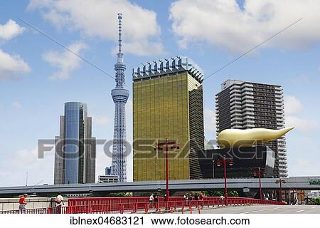 Stock Image - Skytree and the headquarters of the brewery Asahi with Asashi-Flame, Flamme d'Or by Philippe Starck, Tokyo, Japan, Asia. Fotosearch
