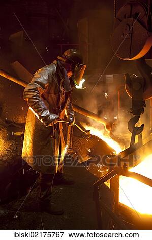 Smelter worker wearing protective equipment, employee of the Luitpoldhuette AG, a foundry that specializes in the casting of engine blocks, motor parts and refrigeration compressors, sampling liquid iron in a furnace, in Amberg, Bavaria, Germany, Europe View Large Photo Image Stock Photo - Smelter worker wearing protective equipment, employee of the Luitpoldhuette AG, a foundry that specializes in the casting of engine blocks, motor parts and refrigeration compressors, sampling liquid iron in a furnace, in Amberg, Bavaria, Germany, Europe. Fotosearch