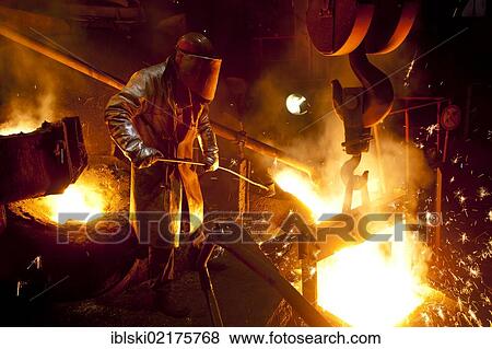 Smelter worker wearing protective equipment, employee of the Luitpoldhuette AG, a foundry that specializes in the casting of engine blocks, motor parts and refrigeration compressors, sampling liquid iron in a furnace, in Amberg, Bavaria, Germany, Europe View Large Photo Image Stock Photo - Smelter worker wearing protective equipment, employee of the Luitpoldhuette AG, a foundry that specializes in the casting of engine blocks, motor parts and refrigeration compressors, sampling liquid iron in a furnace, in Amberg, Bavaria, Germany, Europe. Fotosearch