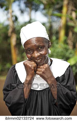 Smiling old woman in a dress for the church choir, Bamenda, Cameroon, Africa View Large Photo Image Picture - Smiling old woman in a dress for the church choir, Bamenda, Cameroon, Africa. Fotosearch
