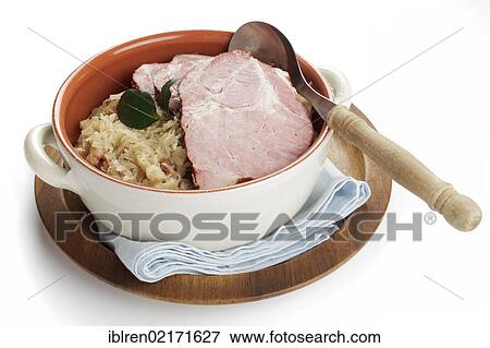 Stock Photo - Smoked pork neck roast on sauerkraut, gammon, Kassel-style pork. Fotosearch