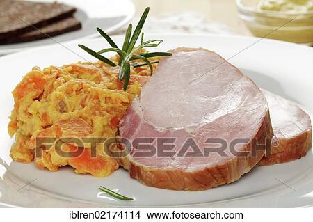 Smoked pork roast, gammon, Kassel-style pork, with carrots, brown bread and mustard View Large Photo Image Picture - Smoked pork roast, gammon, Kassel-style pork, with carrots, brown bread and mustard. Fotosearch