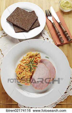 Smoked pork roast, gammon, Kassel-style pork, with carrots, brown bread and mustard View Large Photo Image Stock Photograph - Smoked pork roast, gammon, Kassel-style pork, with carrots, brown bread and mustard. Fotosearch