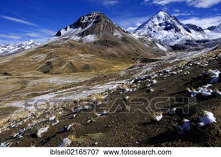 Stock Photo - Snow-covered Andes Mountains with a high plateau at sunrise, La Paz, Bolivia, South America. Fotosearch