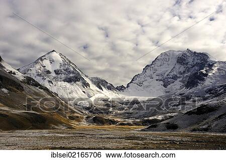 Stock Photograph - Snow-covered Andes Mountains with a high plateau at sunrise, La Paz, Bolivia, South America. Fotosearch