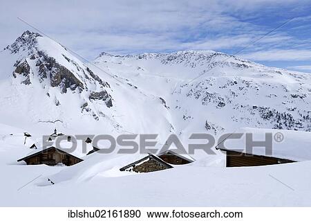 Stock Image - Snow-covered mountain village near the Sennhuette Schnydi in Leukerbad, Valais, Switzerland, Europe. Fotosearch