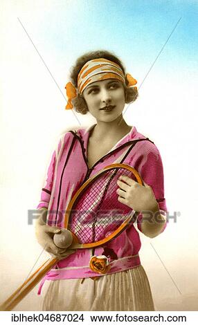 Sports, tennis player, woman in sportswear with tennis racket and ball, 1910s, Germany, Europe View Large Photo Image Picture - Sports, tennis player, woman in sportswear with tennis racket and ball, 1910s, Germany, Europe. Fotosearch
