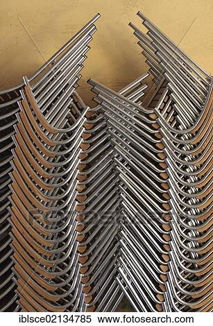 Stacked chairs View Large Photo Image Stock Photography - Stacked chairs. Fotosearch