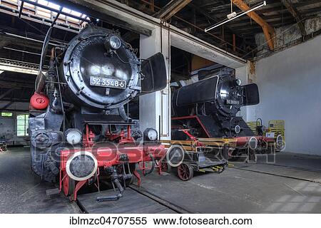Stock Photography - Steam locomotive 52 3548-6 from 1943, right steam locomotive 50 3600-9 from 1941 in the roundhouse, Bavarian Railway Museum Nördlingen, Nördlingen, Bavaria, Germany, Europe. Fotosearch