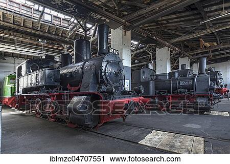 Stock Image - Steam locomotive 89 837 from 1921, right Steam locomotive 7 Füssen from 1889 in the roundhouse, Bavarian Railway Museum Nördlingen, Nördlingen, Bavaria, Germany, Europe. Fotosearch