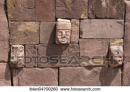 Stock Image - Stone head in Tihuanaku, ruins of pre-Inca cultures, Bolivia, South America. Fotosearch