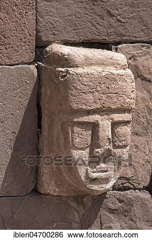 Stock Photograph - Stone head in Tihuanaku, ruins of pre-Inca cultures, Bolivia, South America. Fotosearch
