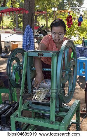 Stock Photo - Street vendor of sugar cane juice with machine, Bagan, Myanmar, Asia. Fotosearch