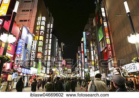 Street with colorful illuminated advertising, shops, restaurants and bars, night view, Shinjuku district, Tokyo, Japan, Asia View Large Photo Image Stock Image - Street with colorful illuminated advertising, shops, restaurants and bars, night view, Shinjuku district, Tokyo, Japan, Asia. Fotosearch