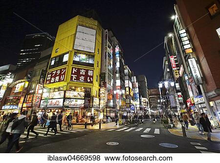 Street with colorful illuminated advertising, shops, restaurants and bars, night view, Shinjuku district, Tokyo, Japan, Asia View Large Photo Image Stock Photo - Street with colorful illuminated advertising, shops, restaurants and bars, night view, Shinjuku district, Tokyo, Japan, Asia. Fotosearch