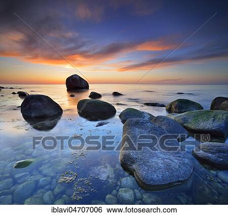 Sunset at the Baltic Sea, boulders on the shore, behind the Schwanenstein, Lohme, Jasmund National Park, Island of Rügen, Mecklenburg-Western Pomerania, Germany, Europe View Large Photo Image Stock Photograph - Sunset at the Baltic Sea, boulders on the shore, behind the Schwanenstein, Lohme, Jasmund National Park, Island of Rügen, Mecklenburg-Western Pomerania, Germany, Europe. Fotosearch