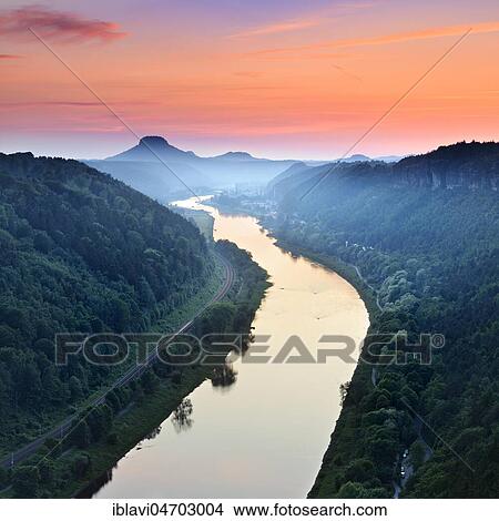 Picture - Sunset in the Elbe Valley, behind the Lilienstein, Elbe Sandstone Mountains, Saxon Switzerland National Park, near Schmilka, Saxony, Germany, Europe. Fotosearch