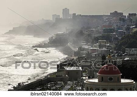 Picture - Surf on the Atlantic coast in the historic town centre of San Juan, San Juan, Puerto Rico, an unincorporated territory of the United States, North America. Fotosearch